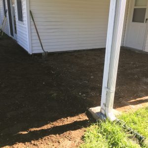 Dirt patch by house