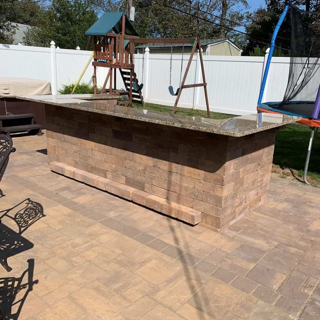 Olde English Wall with Granite Countertop outdoor kitchen