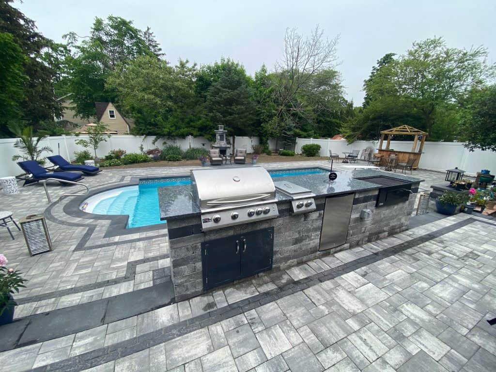 dream outdoor living space in long island by ageless masonry outdoor kitchen patio and fireplace
