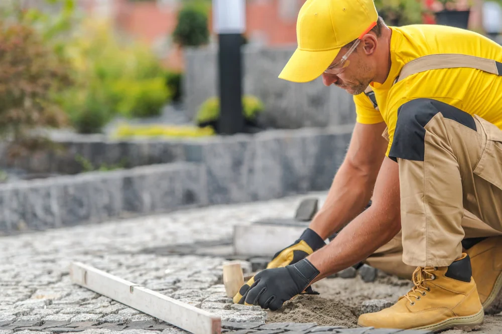Worker Laying Brick Paving Suffolk County New York